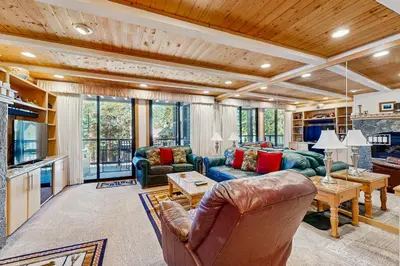 a living room with a couch and a table at Brockway Springs #36 in Kings Beach