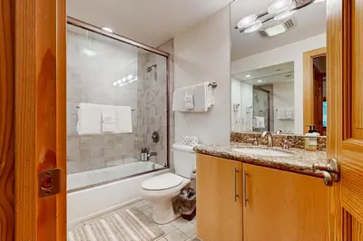 a bathroom with a toilet and a sink and a shower at Brockway Springs #36 in Kings Beach