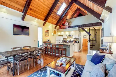 a living room with a couch and a table at Casa del Lago in Tyrolian Village