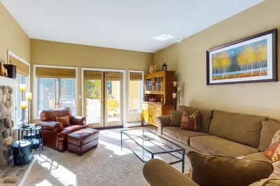 a living room with a couch and two chairs at McCloud 137 in Incline Village