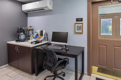 an office with a desk with a computer on it at SureStay Plus Hotel by Best Western Mammoth Lakes in Mammoth Lakes