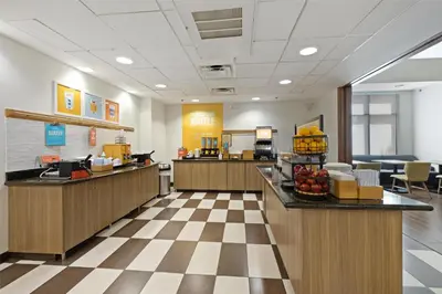 a lobby of a fast food restaurant with a cashier at Hampton Inn & Suites Madera in Madera