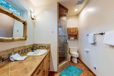 a bathroom with a sink and a shower and a toilet at Everness Dawn Retreat* in Mevers