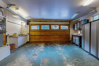 a large kitchen with wooden doors in a garage at Everness Dawn Retreat* in Mevers