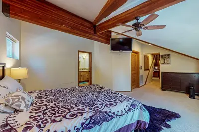 a bedroom with a bed and a ceiling fan at Everness Dawn Retreat* in Mevers