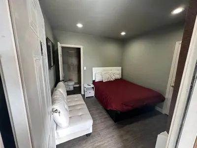 a small bedroom with a bed and a couch at Mountain Trail Lodge and Vacation Rentals in Oakhurst