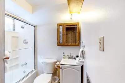 a bathroom with a toilet and a shower and a sink at Picture Perfect Chalet in Prosser Lakeview Estates