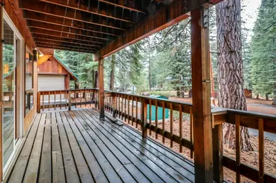 a porch of a cabin with a tree at Picture Perfect Chalet in Prosser Lakeview Estates