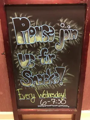a chalkboard with a sign for a party and a show at Hawthorn Suites by Wyndham Rancho Cordova/Folsom in Rancho Cordova