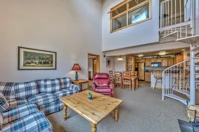 a living room with a couch and a table at Kirkwood Mountain Resort by Vail Resorts in Kirkwood