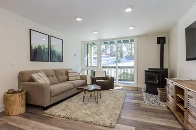 a living room with a couch and a fireplace at Crestview 35 in Mammoth Lakes