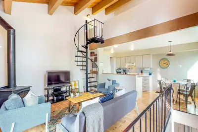 a living room with a couch and a table at Beauty by Kings Beach in Wood Vista