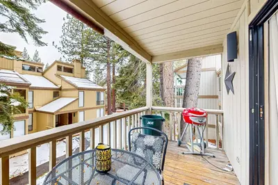 a patio with a table and a grill on a deck at Beauty by Kings Beach in Wood Vista