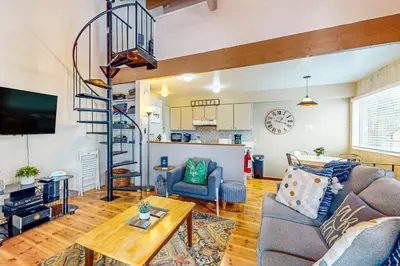 a living room with a couch and a table at Beauty by Kings Beach in Wood Vista