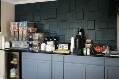 a counter top with a bunch of items on it at Rodeway Inn Near University-Gateway to Yosemite in Merced