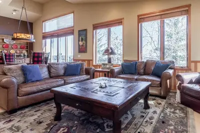 a living room with couches and a coffee table at Snowcreek V 820 in Mammoth Lakes