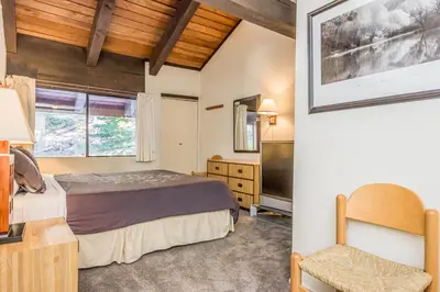a bedroom with a bed and a television at Mammoth Ski and Racquet 132 in Mammoth Lakes