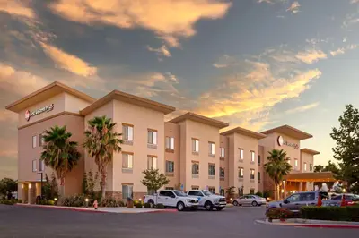 a rendering of a hotel with cars parked in a parking lot at Best Western Plus Coalinga Inn in Coalinga