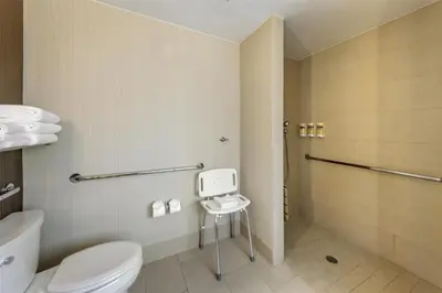 a bathroom with a toilet and a shower at Best Western Plus Truckee-Tahoe Hotel in Truckee