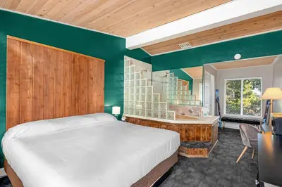 a bedroom with a bed and a desk in a room at The Inn at Boatworks, Lake Tahoe in Tahoe City