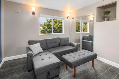 a living room with a couch and a chair at The Inn at Boatworks, Lake Tahoe in Tahoe City