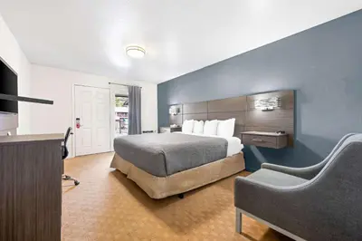 a hotel room with a bed and a television at Econo Lodge Inn & Suites Heavenly Village Area in South Lake Tahoe