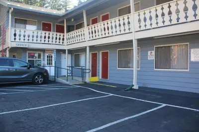 a car parked in a parking lot in front of a building at Thunderchief Inn in South Lake Tahoe