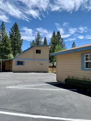 a building with a parking lot in front of it at Stevenson’s Inn in Kings Beach