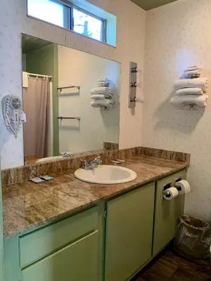 a bathroom with a sink and a mirror at Stevenson’s Inn in Kings Beach