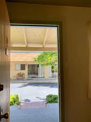 a door to a building with a view of a street at Stevenson’s Inn in Kings Beach