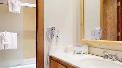 a bathroom with a sink and a phone on the wall at Mammoth West #140 Condo in Mammoth Lakes