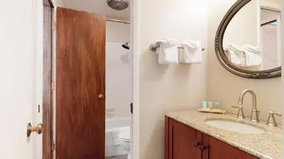 a bathroom with a sink and a mirror at Chateau De Montagne #15 Condo in Mammoth Lakes