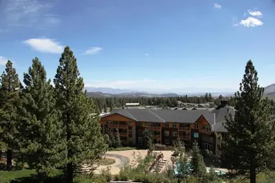 a large building with trees in front of it at Eagle Run #212 Condo in Mammoth Lakes