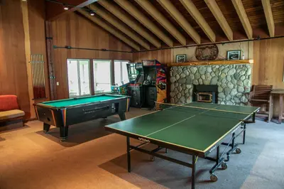 a room with a pool table and a fireplace at Horizons 4 #188 Condo in Mammoth Lakes