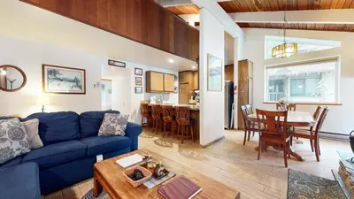 a living room with a blue couch and a table at Horizons 4 #188 Condo in Mammoth Lakes