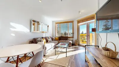 a living room with a couch and a table at Sunstone #109 Condo in Mammoth Lakes
