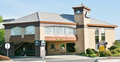 a building with a clock tower on top of it at Days Inn by Wyndham Rocklin/Sacramento in Rocklin