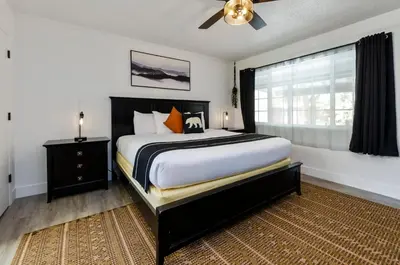 a bedroom with a large bed and a window at The Jeffrey Hotel in South Lake Tahoe