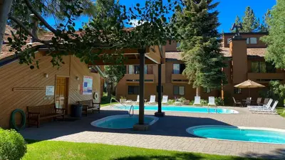 a resort with a pool and a building at Snowflower #49 Condo in Mammoth Lakes