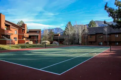 a tennis court in front of a building at Snowflower #49 Condo in Mammoth Lakes