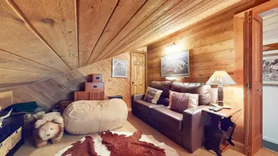 a living room with a couch and a dog in it at Snowcreek II #202 Condo in Mammoth Lakes