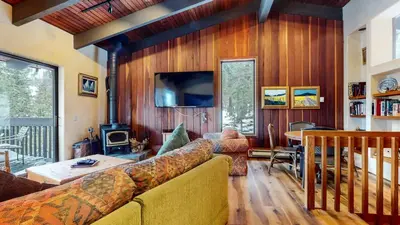 a living room with a couch and a fireplace at Mammoth West #143 Condo in Mammoth Lakes