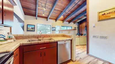 a kitchen with a sink and a dishwasher at Mammoth West #143 Condo in Mammoth Lakes