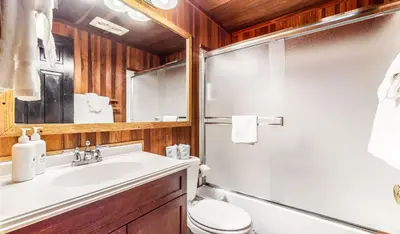 a bathroom with a sink and a toilet and a shower at Sierra Manors #75 Condo in Mammoth Lakes