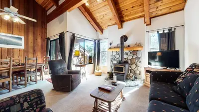 a living room with a couch and a fireplace at Val D'Isere #3 Condo in Mammoth Lakes
