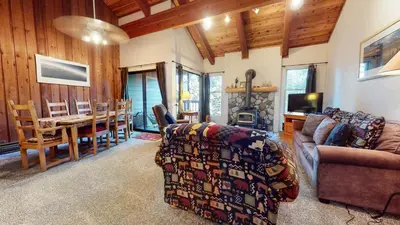 a living room with a couch and a dining room at Val D'Isere #3 Condo in Mammoth Lakes