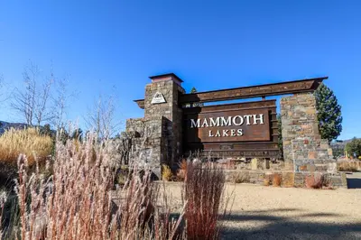 a sign for the mannum takes sign in a field at Sunstone #214 Condo in Mammoth Lakes