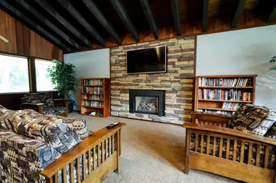 a living room with a couch and a fireplace at Mammoth West #106 Condo in Mammoth Lakes