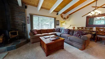 a living room with a couch and a table at Chateau De Montagne #42 Condo in Mammoth Lakes