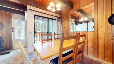 a dining room with a wooden table and chairs at Val D'Isere #6 Condo in Mammoth Lakes